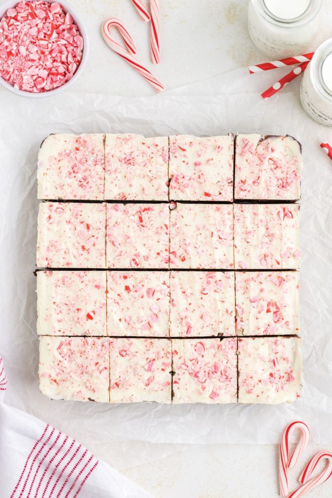 Peppermint bark brownies spread out on counter