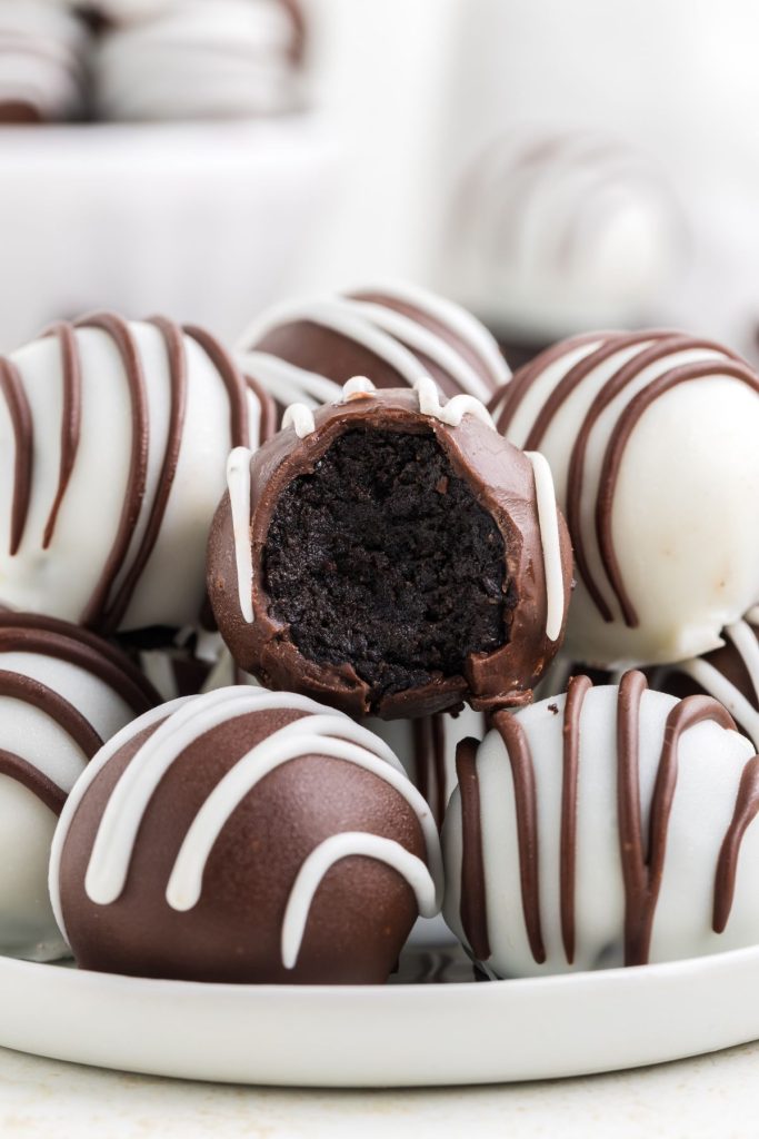 Stack of Oreo truffle balls with bite missing from one ball.