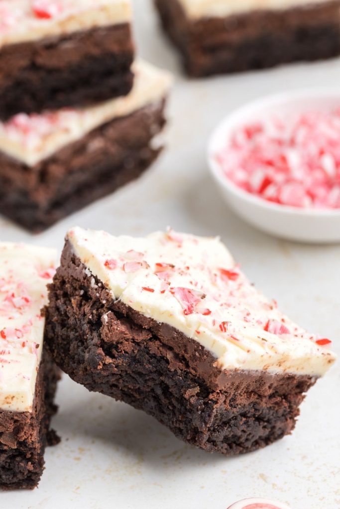 Peppermint bark brownie with a bite take out of it.