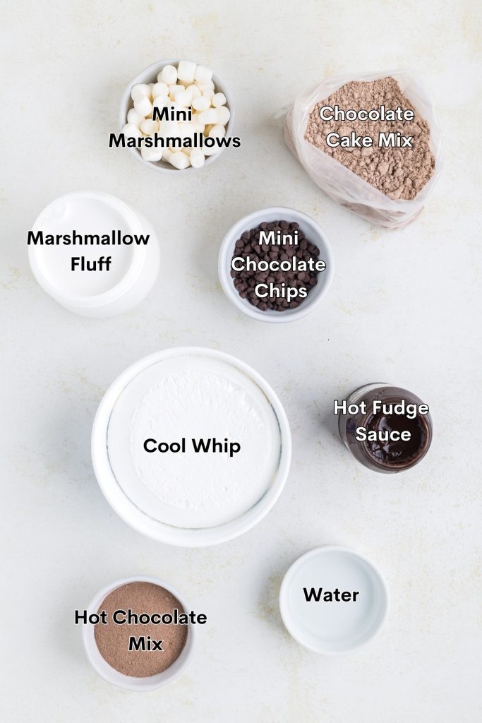 Ingredients needed to make hot chocolate poke cake displayed on counter top