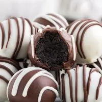 Stack of Oreo truffle balls with bite missing from one ball.