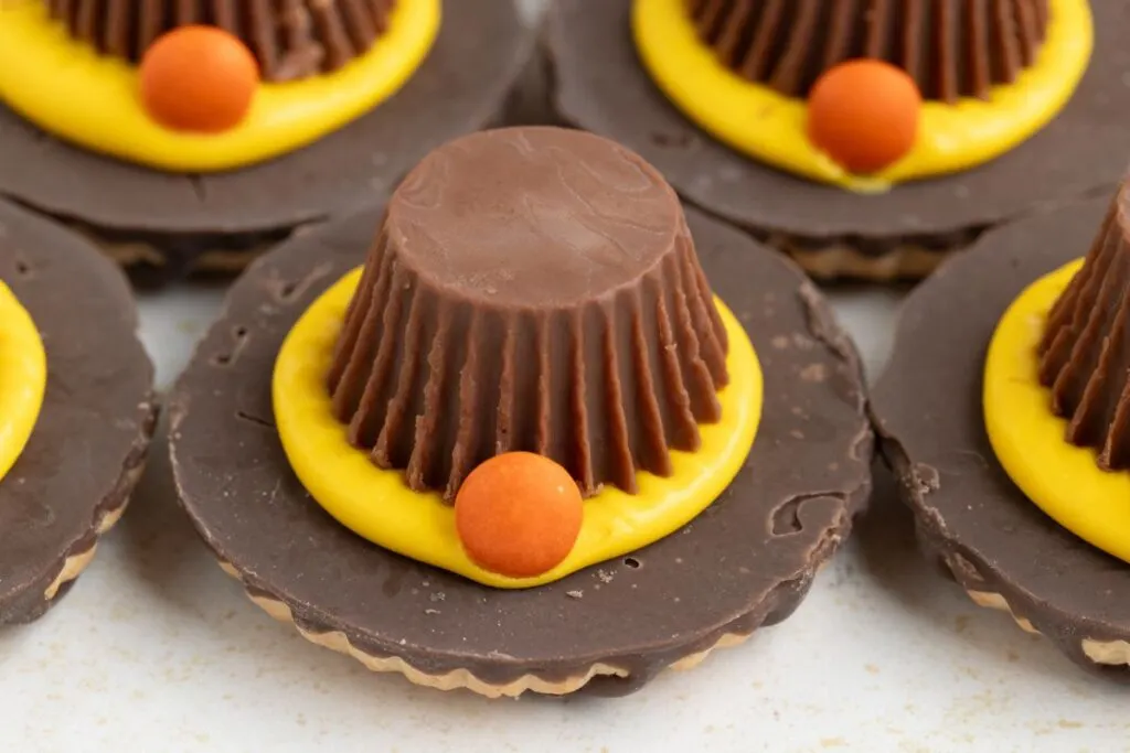 Easy no-bake pilgrim hat cookies with fudge-stripe cookies.