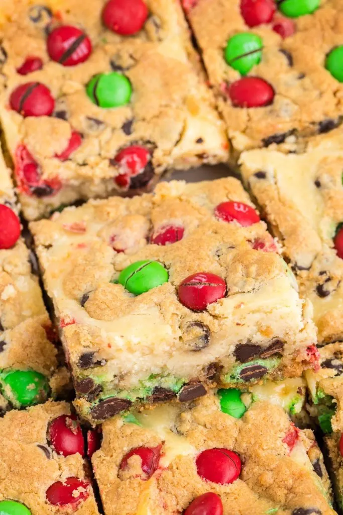 Close up shot of a single Christmas Cookie Cheesecake Bar.