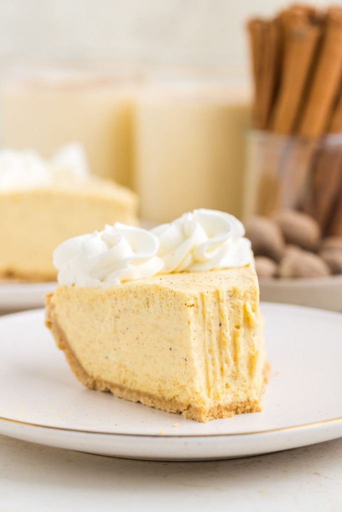 No-bake eggnog pie on a plate with forkful missing. 