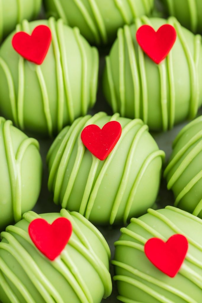 Close-up of Grinch truffles laid out in a row.