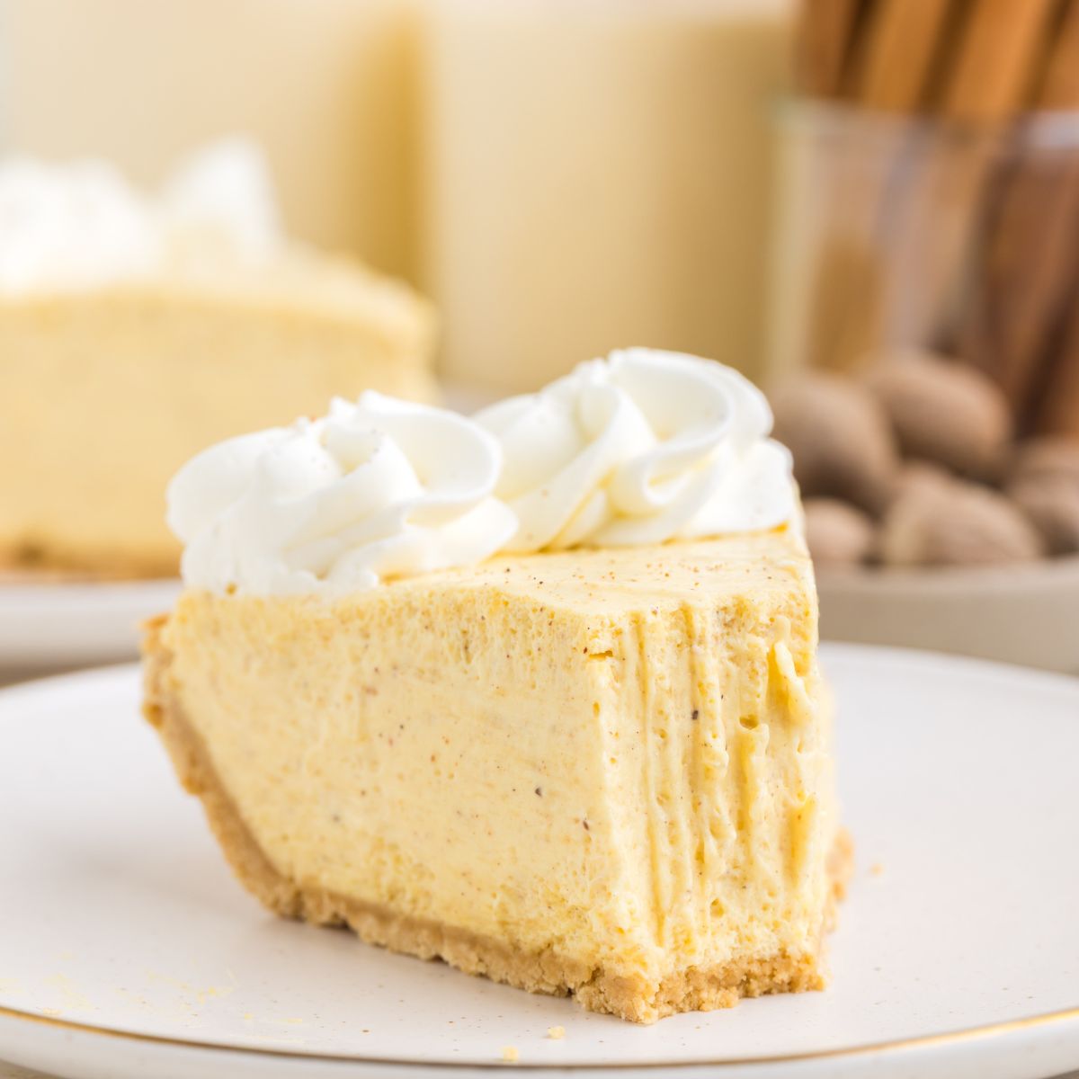 No-bake eggnog pie on a plate with forkful missing.