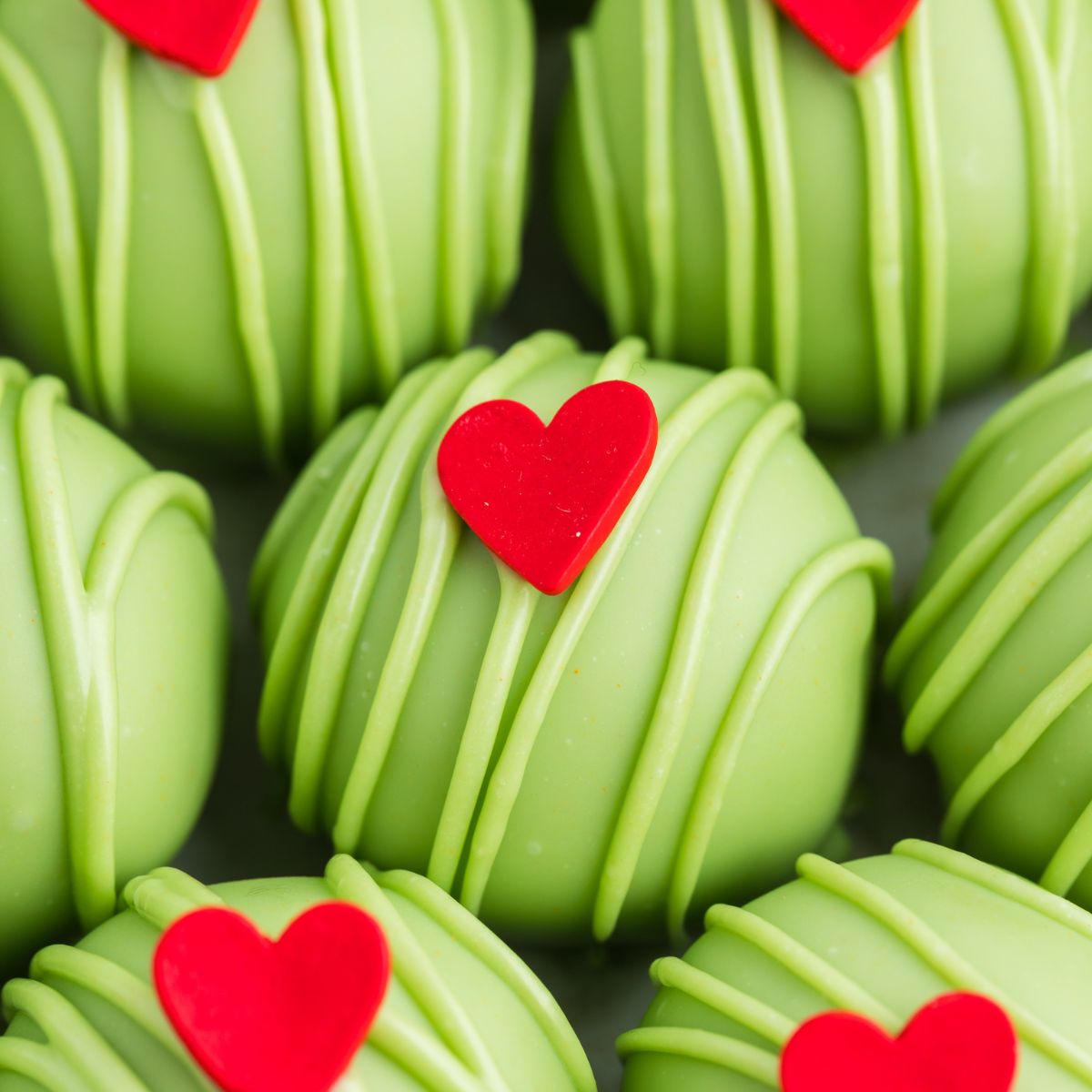 Close-up of Grinch truffles laid out in a row.