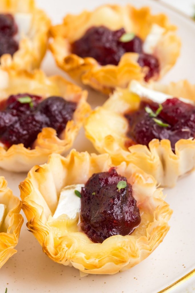 Group of Brie and cranberry phyllo cups.