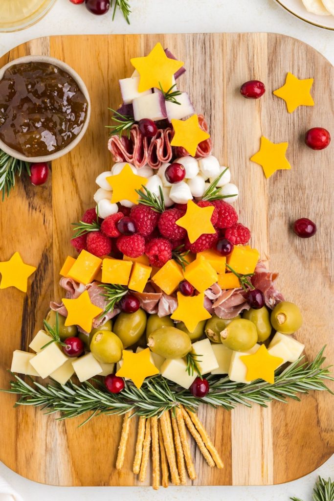 Christmas Tree Charcuterie displayed on wooden board. 