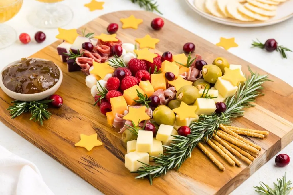 Christmas Tree Charcuterie displayed on wooden board.