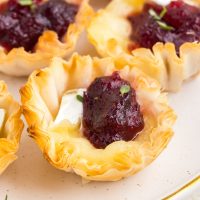 Group of Brie and cranberry phyllo cups.