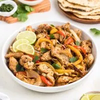 Air fryer chicken fajitas in a bowl on the counter