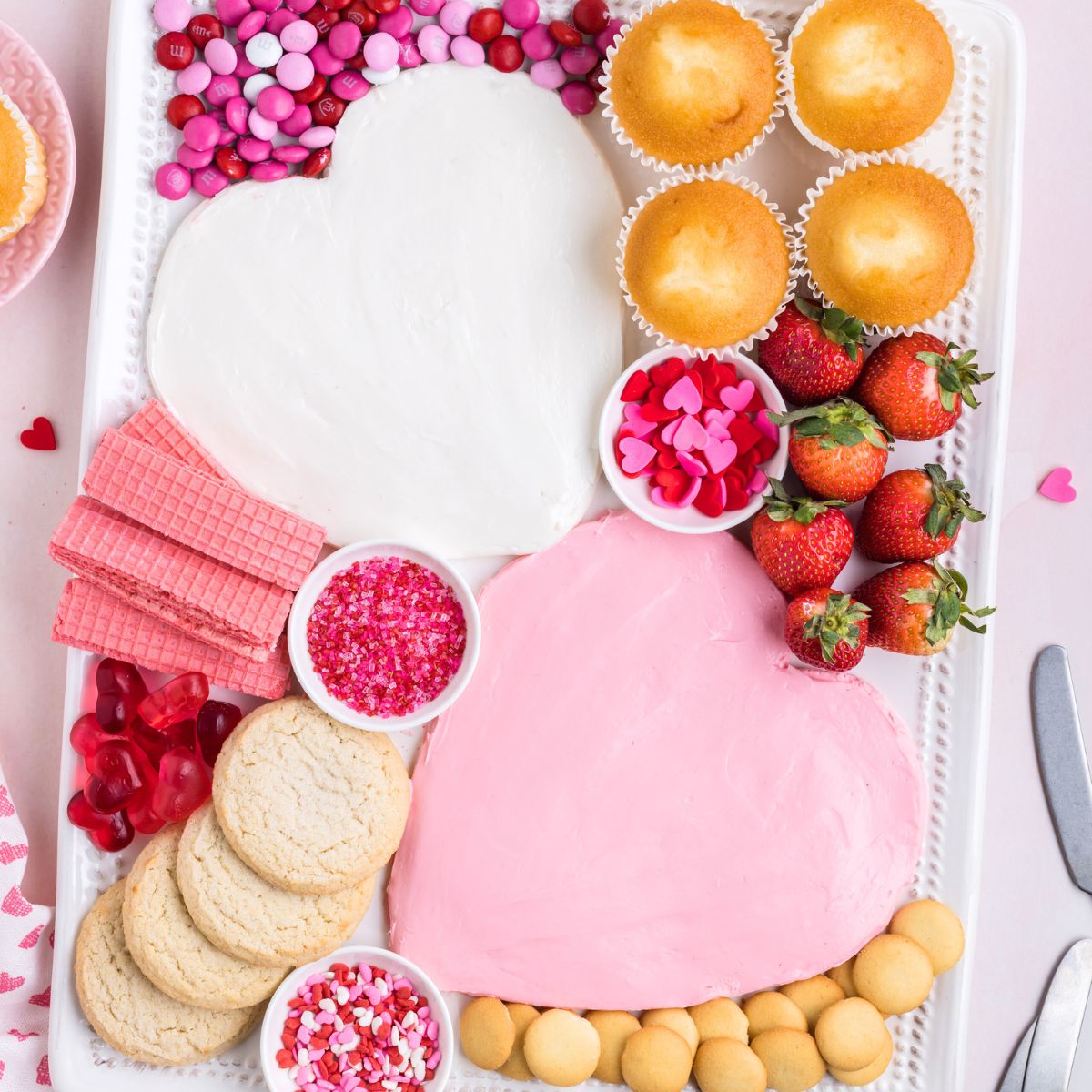 Valentine's Day dessert frosting board on the counter.