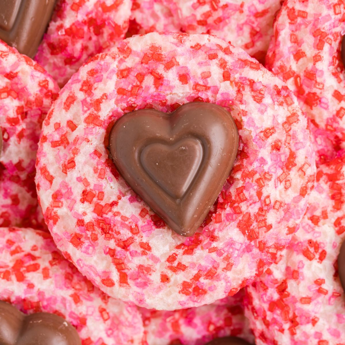 A pile of Valentine's Day sparkle sugar cookies.