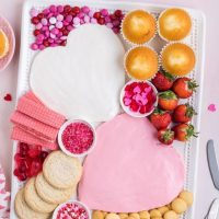 Valentine's Day dessert frosting board on the counter.