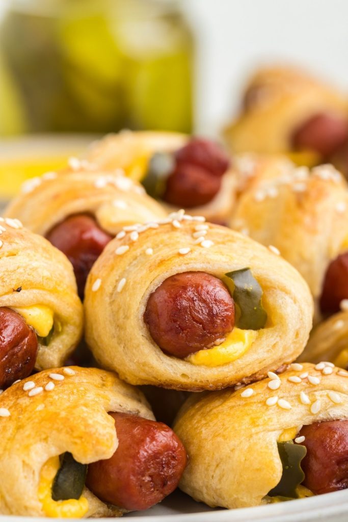 Pile of cheeseburger pigs in a blanket. 