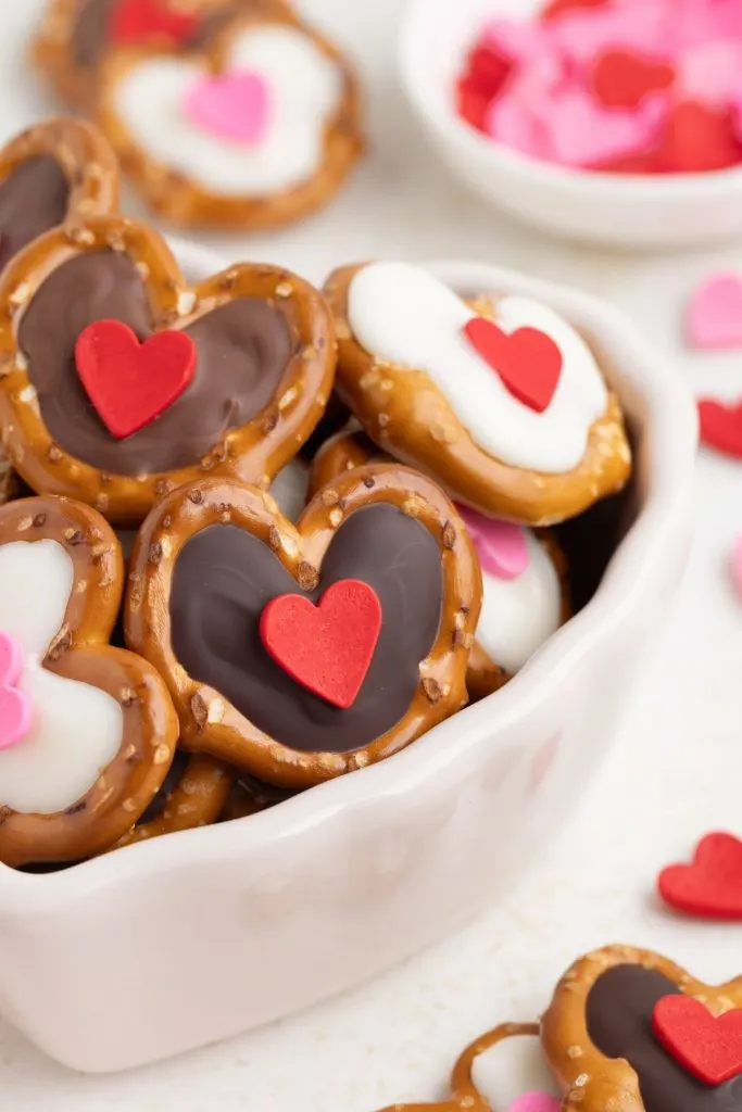 Chocolate Valentine heart pretzels in a bowl.