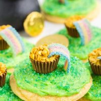 Pot of gold cookies piled on the counter surrounded by gold coins.