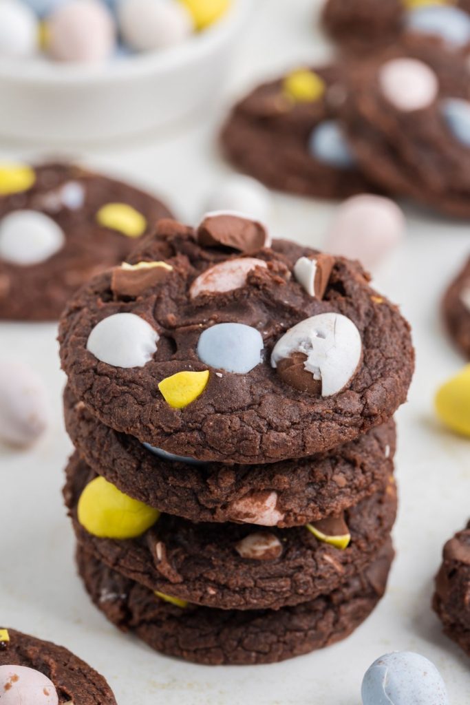 Stack of mini egg brownie cookies - bite-sized treats with a rich, fudgy texture and colorful mini eggs on top.