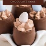 Chocolate mousse-filled Easter eggs topped with candy, arranged in a white holder. Text: Mousse Filled Chocolate Eggs.
