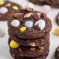 Stack of mini egg brownie cookies - bite-sized treats with a rich, fudgy texture and colorful mini eggs on top.