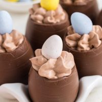 Chocolate mousse filled Easter eggs in a white egg carton.