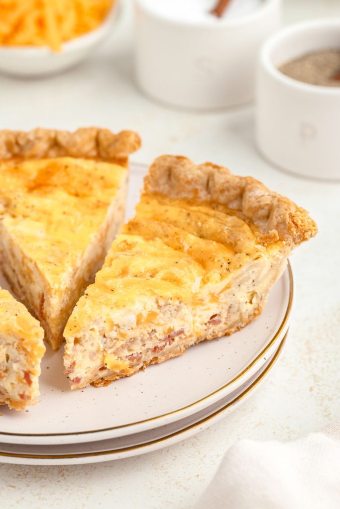 Three slices of cheese, egg, and bacon quiche. 