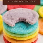 Stack of colorful Jello cookies, one bitten, on white surface. Text: Jello Cookies with sugar cookie mix.