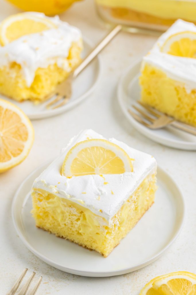 Lemon poke cake with creamy lemon pudding and whipped topping. 