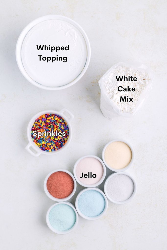 Ingredients such as cake mix, whipped topping, and jello displayed on the counter.