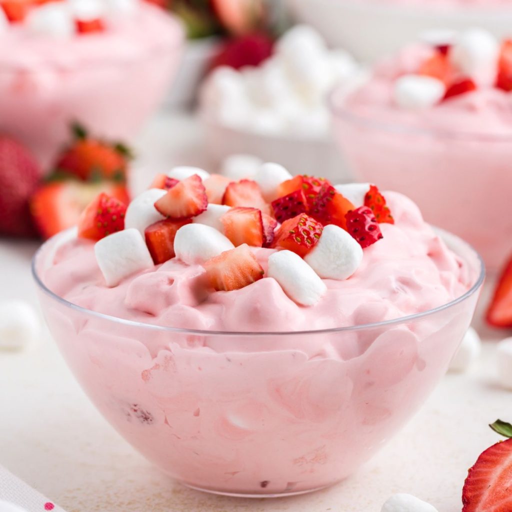 Bowl of fluffy strawberry dessert with marshmallows.