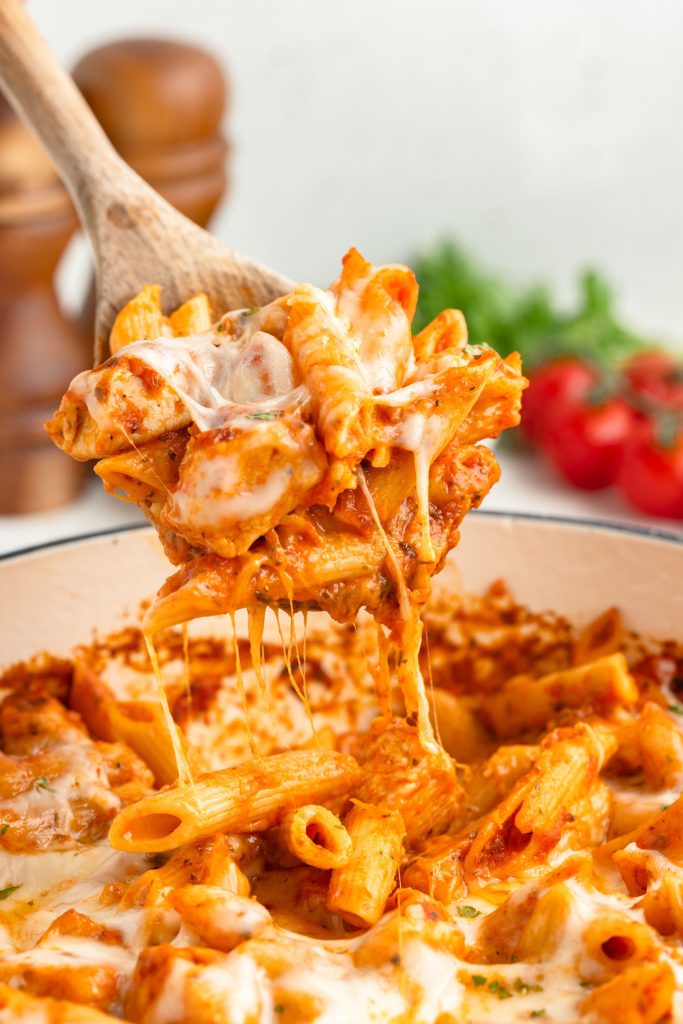 Scoop of cheesy chicken parmesan pasta. 