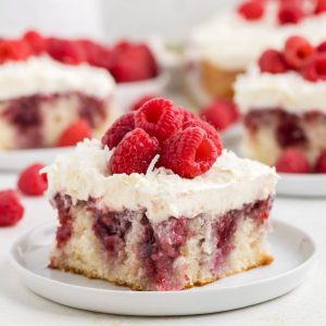Delicious coconut poke cake with raspberry filling.