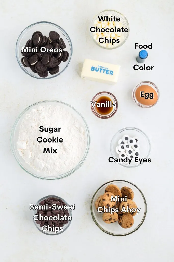 Ingredients such as sugar cookie mix, mini Oreos, mini chocolate chip cookies, butter, egg and more displayed on the counter.