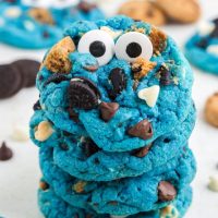 Cookie Monster cookies with big candy eyes stacked on each other.