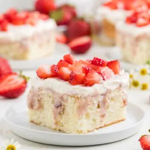 Moist strawberry poke cake with cheesecake filling.