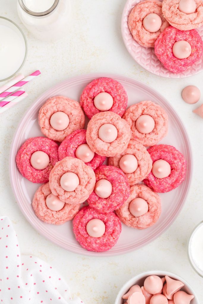 Cream cheese strawberry cake mix kiss cookies on a pink plate.