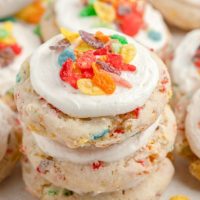 Stack of three fruity pebble cookies made from cake mix.