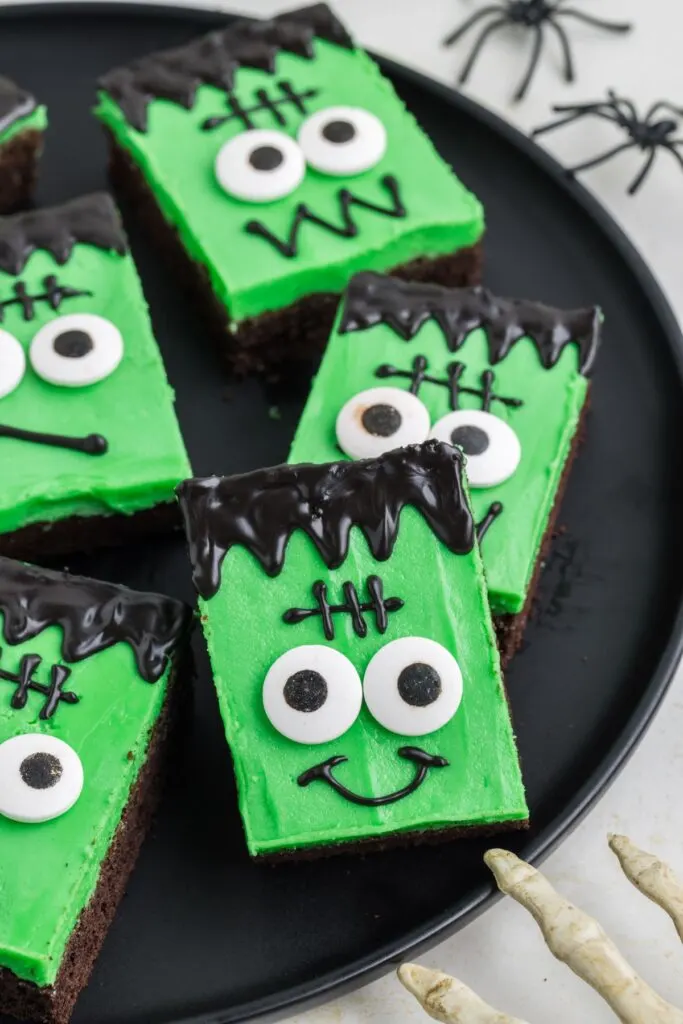 Chocolate cookie bars decorated with green frosting to look like Frankenstein.