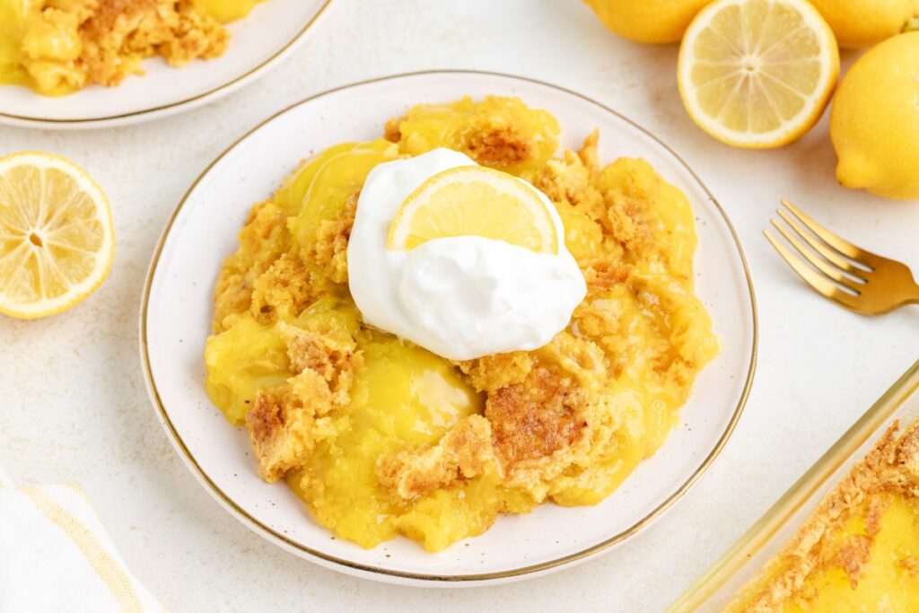 Serving of lemon dump cake on a plate.