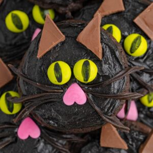 Pile of black cat cookies made with cake mix.