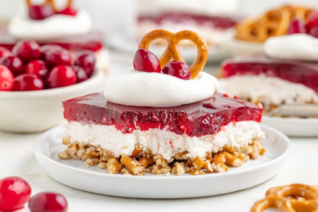 Cranberry jello pretzel salad on a plate.