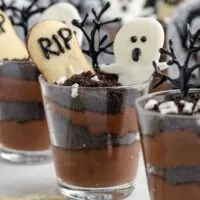 Halloween Graveyard Pudding Cups with white chocolate ghosts.