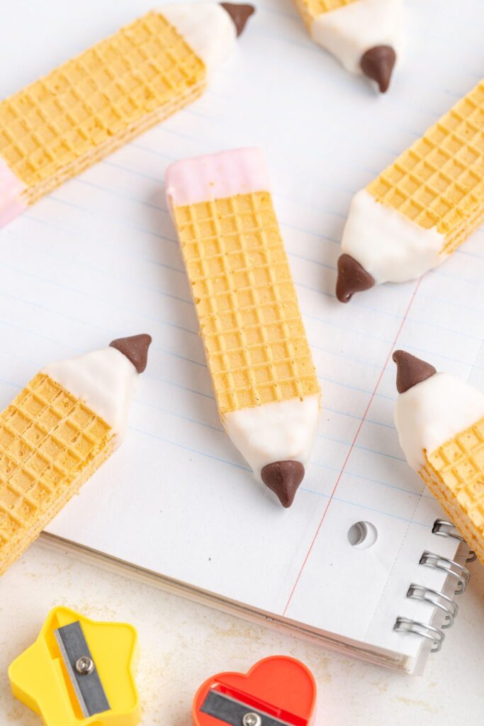 Wafer cookies on a ruled notebook.