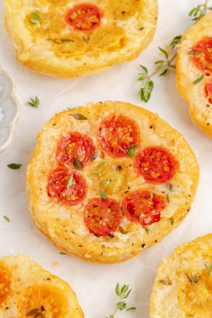 Tomato puff pastry tarts with fresh thyme.