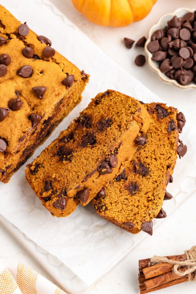 Two slices of 3-ingredient pumpkin bread with chocolate chips.