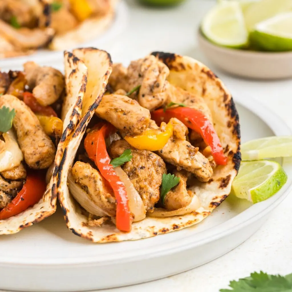 Air fryer chicken fajitas in flour tortillas.