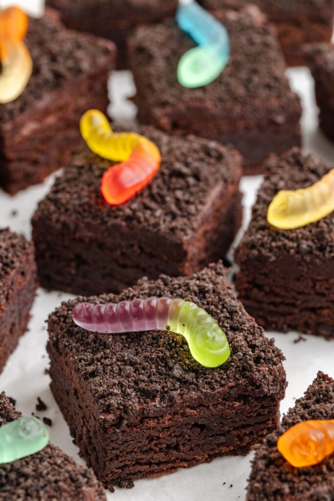 Chocolate brownies with Oreo 'dirt' and gummy worms.