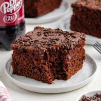 Slice of Dr Pepper cake with a forkful of cake removed.