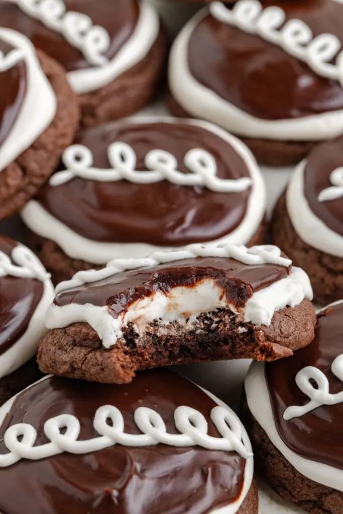 Pile of Hostess cupcake cookies with a bite missing from one cookie.